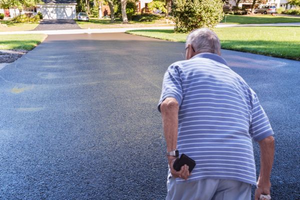 How long should you wait before walking on a newly sealed driveway