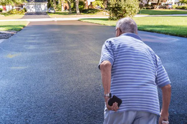 How long should you wait before walking on a newly sealed driveway